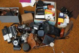 A collection of vintage cameras, recorder, lights,