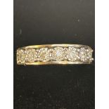 9ct Gold ring set with 7 diamonds .25 carat Size L