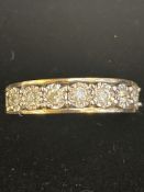 9ct Gold ring set with 7 diamonds .25 carat Size L