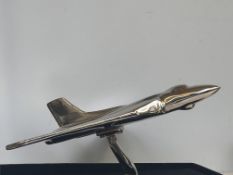 Large chrome vulcan bomber on stand