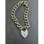 Silver bracelet & heart shaped locket Weight 40g