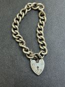 Silver bracelet & heart shaped locket Weight 40g