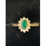 9ct Gold ring set with central green stones surrou