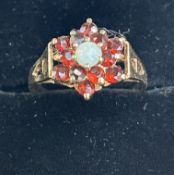 9ct Gold ring set with garnets cluster & central o