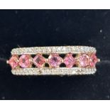 9ct Gold ring diamonds surrounding 7 pink stones S