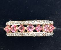 9ct Gold ring diamonds surrounding 7 pink stones S