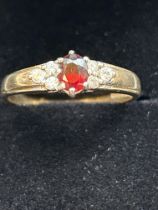 9ct Gold ring set with red garnet & cz stones Size