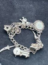 Silver charm bracelet - 14 charms