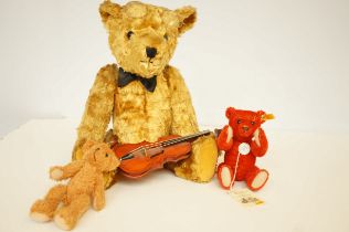 A Gormar bear together with a Steiff miniature bea