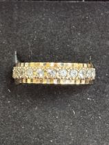 9ct gold full eternity ring set with white stones,