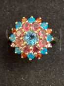 9ct gold cluster ring set with blue and purple sto