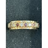 9ct Gold full eternity ring set with garnets & whi
