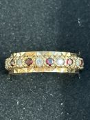 9ct Gold full eternity ring set with garnets & whi