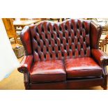 Red leather wingback two seater Chesterfield no ri