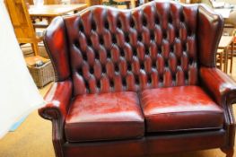 Red leather wingback two seater Chesterfield no ri