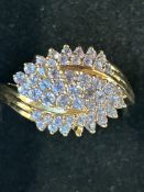 9ct Gold ring set with a cluster of blue stones We