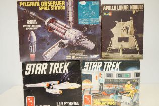 Four vintage model kits to include two Star Trek