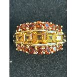 9ct Gold ring set with 14 garnets & 5 amber stones