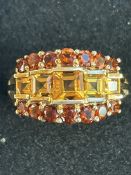 9ct Gold ring set with 14 garnets & 5 amber stones