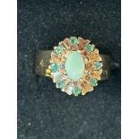 9ct Gold ring set with central opal surrounding by