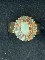 9ct Gold ring set with central opal surrounding by