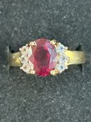 9ct gold dress ring set with large red stone Weigh