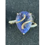 9ct Gold dress ring set with large blue stone & di