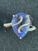 9ct Gold dress ring set with large blue stone & di