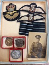 Military badges to include a photograph & 3 other