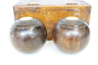 Pair of lignum bowls with box