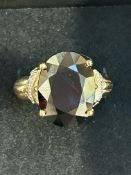 9ct gold very large dress ring set with large red