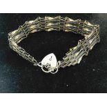 9ct gold gate bracelet with heart shaped locket an