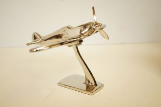 Chrome Spitfire aeroplane on a stand