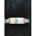 9ct Gold eternity ring set with blue & white stone