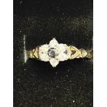 9ct Gold ring set with central garnet surrounded