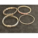 Four silver bangles