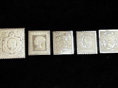 Five silver ingots in the form of postage stamps,
