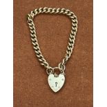 9ct Gold bracelet with heart locket and safety cha