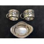 2 silver coffee can holders together with a pierce