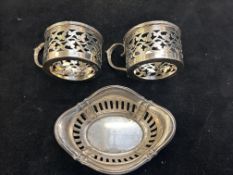 2 silver coffee can holders together with a pierce