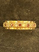 9ct Gold full eternity ring set with garnets & whi