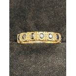 9ct Gold ring set with 7 sapphires Size K