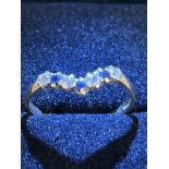 9ct Gold wishbone ring set with sapphires & cz sto