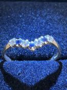 9ct Gold wishbone ring set with sapphires & cz sto