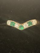 9ct gold wishbone ring set with green stones and C