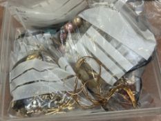 Large box of unsorted costume jewellery