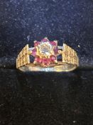 9ct Gold ring set with rubies & small central diam