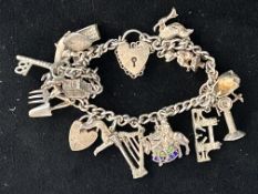 Silver charm bracelet - 18 charms