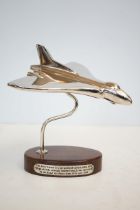 Chrome vulcan bomber on wooden base