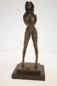 Bronze figure of a topless lady on a marble base s